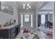 Welcoming entryway with stylish tile, a console table, and views to the dining room, creating a warm first impression at 34 David Ln, Indianapolis, IN 46227