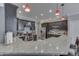 Kitchen with stainless steel appliances, dark cabinets, granite counters, and an eat-in bar at 34 David Ln, Indianapolis, IN 46227