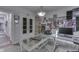 Another view of office with glass desk and gray walls decorated with posters and shelving at 34 David Ln, Indianapolis, IN 46227