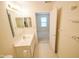 Bathroom featuring a vanity with lots of cabinet space with an open doorway to a bedroom at 3925 Oak Harbor Ln, Indianapolis, IN 46237