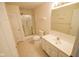 Bright bathroom featuring a shower, white toilet, and vanity with ample storage space at 3925 Oak Harbor Ln, Indianapolis, IN 46237