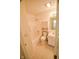 Bathroom with shower, toilet and sink and storage cabinet at 3925 Oak Harbor Ln, Indianapolis, IN 46237