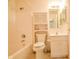Bathroom with shower, toilet, sink and an overhead cabinet at 3925 Oak Harbor Ln, Indianapolis, IN 46237