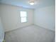 Bedroom featuring a window for natural light and neutral carpeting at 3925 Oak Harbor Ln, Indianapolis, IN 46237