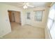 Bedroom featuring a ceiling fan and access to the screened in porch area at 3925 Oak Harbor Ln, Indianapolis, IN 46237