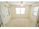Cozy bedroom featuring a ceiling fan and ample natural light from multiple windows at 3925 Oak Harbor Ln, Indianapolis, IN 46237