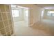 Bright living room with French doors and views of the additional bedroom at 3925 Oak Harbor Ln, Indianapolis, IN 46237