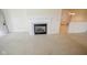 Neutral carpeted living area with fireplace and doorway at 3925 Oak Harbor Ln, Indianapolis, IN 46237