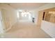 Spacious living room with fireplace, neutral carpet, and abundant natural light at 3925 Oak Harbor Ln, Indianapolis, IN 46237