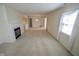 Bright and airy living room with a fireplace and view into the dining area at 3925 Oak Harbor Ln, Indianapolis, IN 46237
