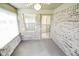 Inviting screened porch with ceiling fan, brick accents, and views of the outdoors at 3925 Oak Harbor Ln, Indianapolis, IN 46237