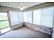 Relaxing screened porch with brick accents and ceiling fan at 3925 Oak Harbor Ln, Indianapolis, IN 46237