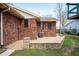 Backyard patio with brick wall, AC unit and well-maintained lawn at 4411 W Friar Dr, Muncie, IN 47304