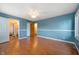 Bright bedroom with hardwood floors, large windows, closet, and ensuite bathroom at 4411 W Friar Dr, Muncie, IN 47304