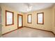 Bedroom with three windows and access to the backyard through a glass door at 4411 W Friar Dr, Muncie, IN 47304