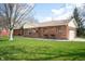 Brick home with attached two car garage and well maintained lawn at 4411 W Friar Dr, Muncie, IN 47304