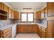 Eat-in kitchen featuring light colored cabinetry, tile backsplash, and updated sink at 4411 W Friar Dr, Muncie, IN 47304