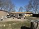 Spacious backyard featuring a patio, fire pit, and well-maintained lawn, perfect for outdoor gatherings at 445 E 1000 N, Alexandria, IN 46001