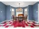 Bright dining room with a stylish chandelier and charming flooring at 453 S High School Rd, Indianapolis, IN 46241