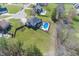Expansive backyard with an in-ground pool in a residential neighborhood, as seen from above at 4644 S Grassy Ct, New Palestine, IN 46163