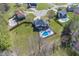 Overhead shot of a home with a spacious yard and inviting in-ground pool at 4644 S Grassy Ct, New Palestine, IN 46163