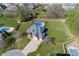 Stunning aerial view of a single-Gathering home with a large backyard and in-ground pool at 4644 S Grassy Ct, New Palestine, IN 46163