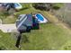 A high angle shot of a backyard featuring an in-ground pool and ample green space at 4644 S Grassy Ct, New Palestine, IN 46163