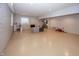 Large finished basement with a play area, TV, and storage shelves at 4644 S Grassy Ct, New Palestine, IN 46163