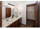 Bathroom featuring a double sink, and a separate toilet room at 4644 S Grassy Ct, New Palestine, IN 46163