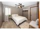 Neutral bedroom featuring a ceiling fan, white comforter, and simple decor at 4644 S Grassy Ct, New Palestine, IN 46163