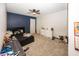 Bedroom with carpet flooring, ceiling fan, dresser, and a bed with decorative items at 4644 S Grassy Ct, New Palestine, IN 46163