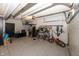 Well-organized garage with epoxy floors, plenty of storage and bicycles on the wall, maximizing space and functionality at 4644 S Grassy Ct, New Palestine, IN 46163