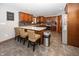 Spacious kitchen with a breakfast bar, stainless steel appliances, and wood cabinets at 4644 S Grassy Ct, New Palestine, IN 46163