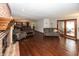Relaxing living room with hardwood floors, brick fireplace, and comfortable sofa set at 4644 S Grassy Ct, New Palestine, IN 46163