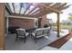 Outdoor patio with pergola, seating, and an outdoor grill at 4644 S Grassy Ct, New Palestine, IN 46163