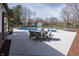 Spacious patio area featuring an in-ground pool, outdoor dining, creating an ideal setting for entertaining and relaxation at 4644 S Grassy Ct, New Palestine, IN 46163