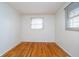 Comfortable bedroom with hardwood floors and a large window for natural light at 5061 Sylvan Rd, Indianapolis, IN 46228
