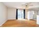 Cozy living area with hardwood floors, sliding glass door, and a ceiling fan at 5061 Sylvan Rd, Indianapolis, IN 46228