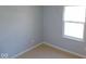 Minimalist bedroom design with plenty of natural light, ready for new owners to customize to their taste and style at 5523 Epperson Ct, Indianapolis, IN 46221