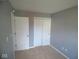 Neutral bedroom with closet storage offers a blank canvas to create a cozy and personalized living space at 5523 Epperson Ct, Indianapolis, IN 46221