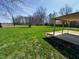 A very large grassy backyard with a covered patio offers a peaceful retreat at 5630 S Cladwell Dr, Pendleton, IN 46064