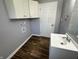 Bathroom featuring a sink, cabinets, and laundry hookups at 5630 S Cladwell Dr, Pendleton, IN 46064