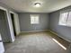 A standard bedroom featuring two windows and a closet at 5630 S Cladwell Dr, Pendleton, IN 46064