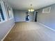 A view of the dining room, showing neutral-toned walls and carpet at 5630 S Cladwell Dr, Pendleton, IN 46064