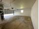 An empty garage with the door partly opened at 5630 S Cladwell Dr, Pendleton, IN 46064