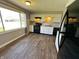 Kitchen with a window overlooking a large yard and black appliances at 5630 S Cladwell Dr, Pendleton, IN 46064