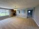 Spacious living room with brick fireplace and large windows offering natural light at 5630 S Cladwell Dr, Pendleton, IN 46064