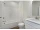 Well-lit bathroom featuring a shower and tub combination, toilet, and granite vanity top at 5653 Stetson Dr, Whitestown, IN 46052