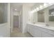 Bathroom featuring double sinks with quartz countertops and tiled floors at 5653 Stetson Dr, Whitestown, IN 46052