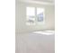Bedroom featuring large windows with neighborhood views and soft, neutral carpeting at 5653 Stetson Dr, Whitestown, IN 46052